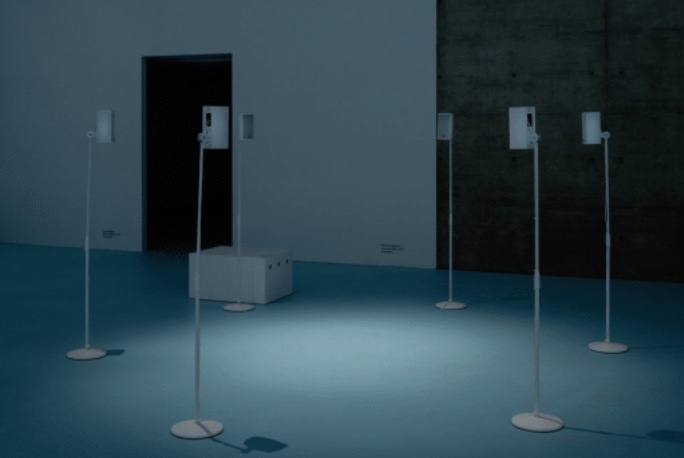An installation of multiple stands positioned in a circle, facing inwards.