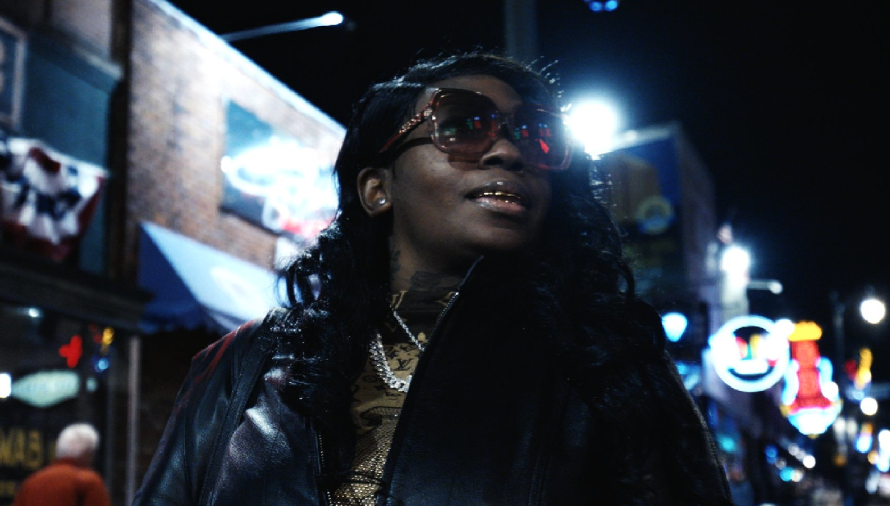 La Chat walking through the city